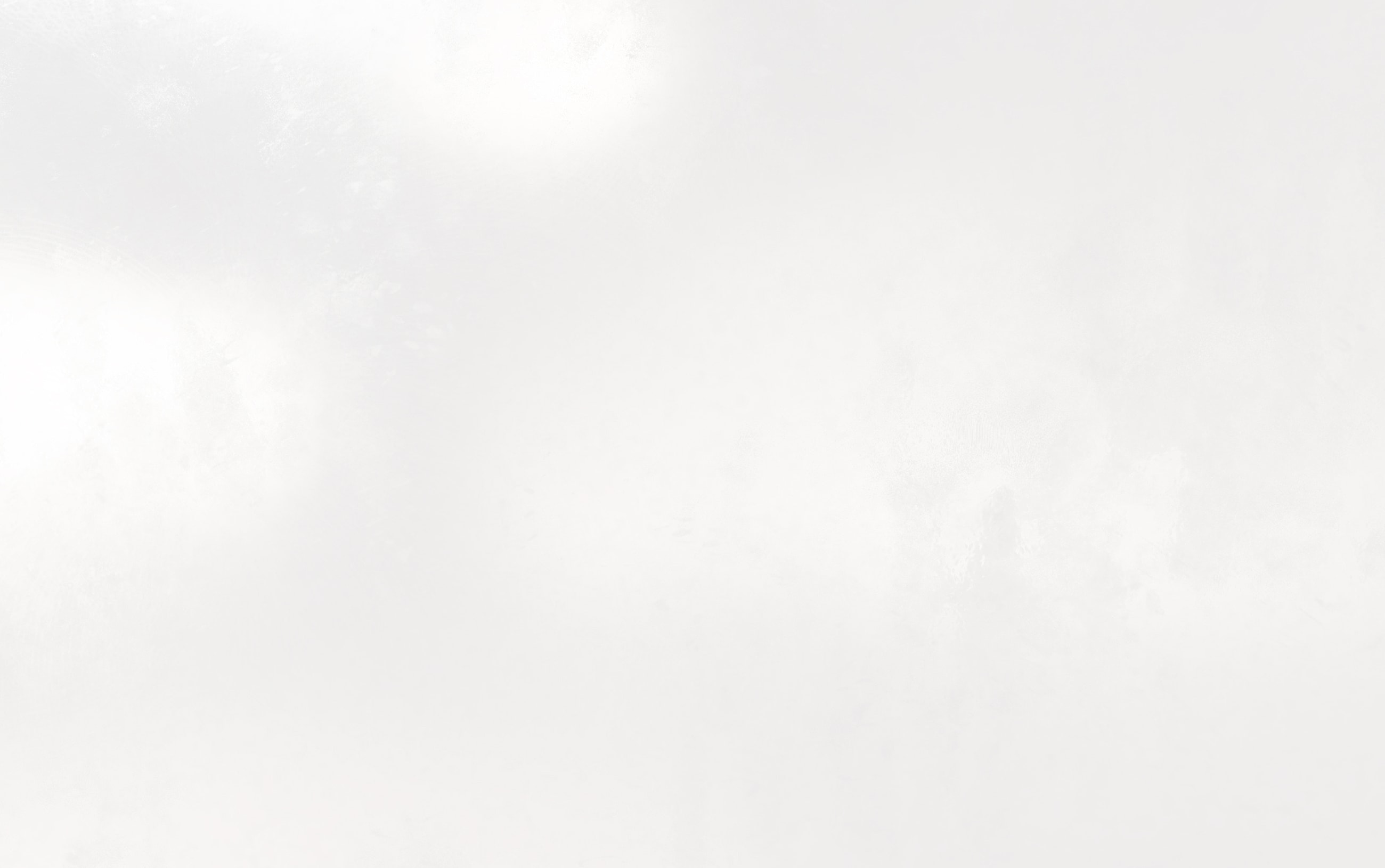 Abstract white textured background with subtle variations.