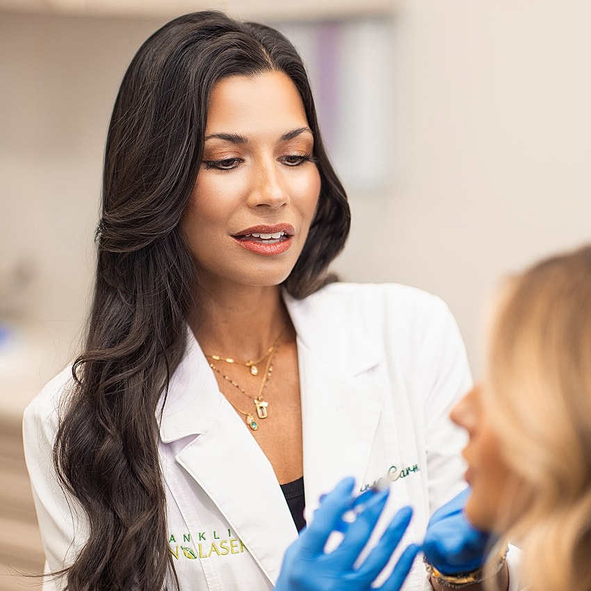 Doctor consulting patient in a medical setting.