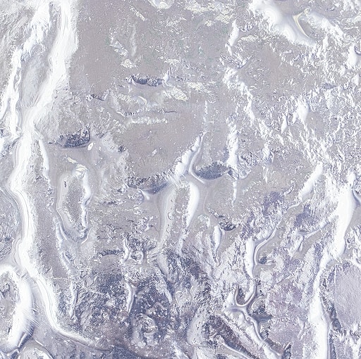 Abstract textured surface with wavy patterns.